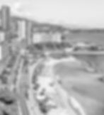 Luxury beachfront view of Monaco’s Larvotto district with exclusive residences, coastal road and Mediterranean shoreline.