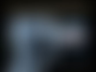 A human silhouette with a flashlight renders a section of the street, while the rest of the environment remains as abstract unrendered quantum space and code.