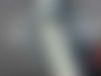 Water spraying from a leaking hose with digital overlay indicating "Leaking, Hose 2" in red. Background is blurred. Mood: urgent.