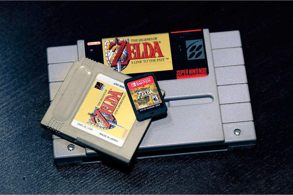 The Legend of Zelda SNES cartridge, Gameboy cartridge, and Nintendo Switch cartridge