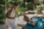 A serene sound healing session unfolds by the pool at Lunita Jungle Retreat Center, where participants relax and immerse themselves in calming vibrations.