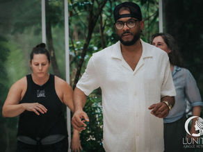 Participants share joyful moments and connection during a vibrant Caribbean dance class at Lunita Jungle Retreat Center Riviera Maya Mexico.