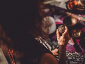 A participant holds a beautifully crafted ceremonial object during a spiritual gathering at the Lunita Jungle Retreat Center in Puerto Morelos, Riviera Maya, Mexico.