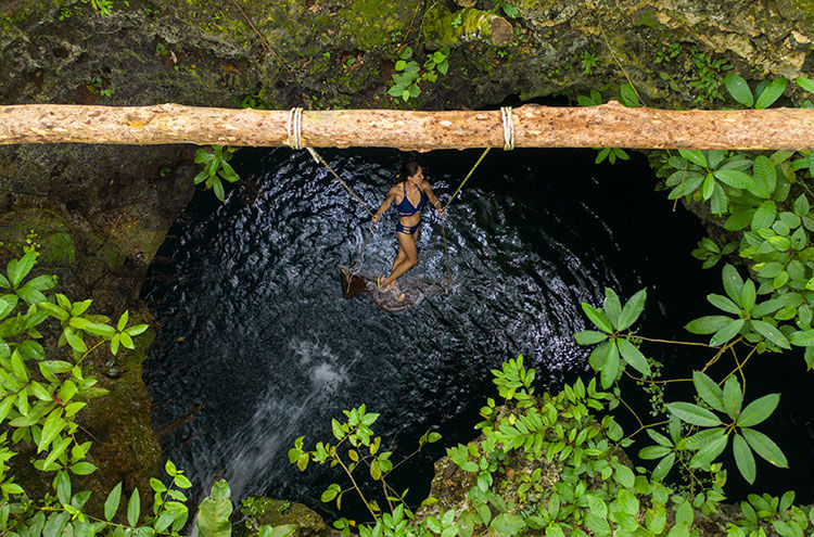 A serene moment at a private cenote during the Cenote Exploration Retreat, offering a perfect blend of adventure and tranquility.
