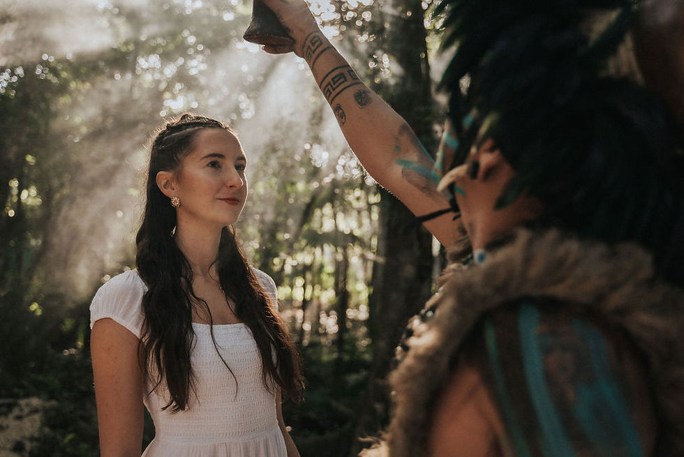 A woman participates in a sacred blessing ceremony during an ancestral healing event at Lunita Jungle Retreat Center, nestled in the lush surroundings of Mexico's Riviera Maya.