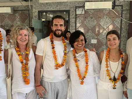 Retreat participants gathered at the Lunita Jungle Retreat Center in Mexico, October 2025, wearing floral garlands and white attire during Melissa's beautifully organized event.