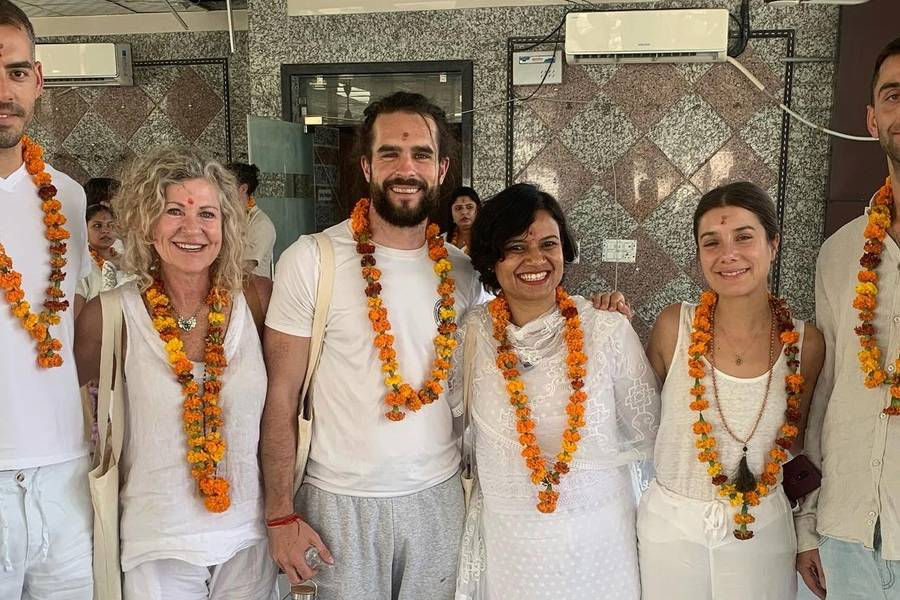 Retreat participants gathered at the Lunita Jungle Retreat Center in Mexico, October 2025, wearing floral garlands and white attire during Melissa's beautifully organized event.