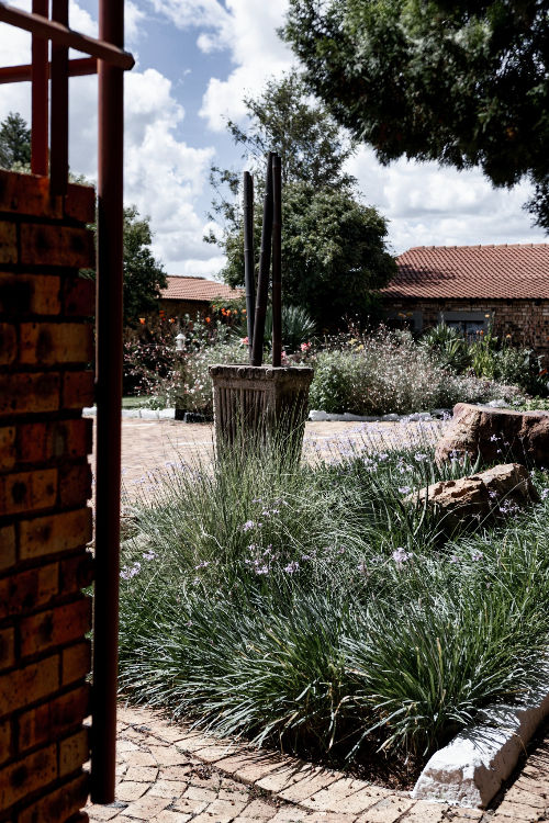 Landscaped courtyard and garden area at RenGwe Guesthouse with peaceful outdoor surroundings
