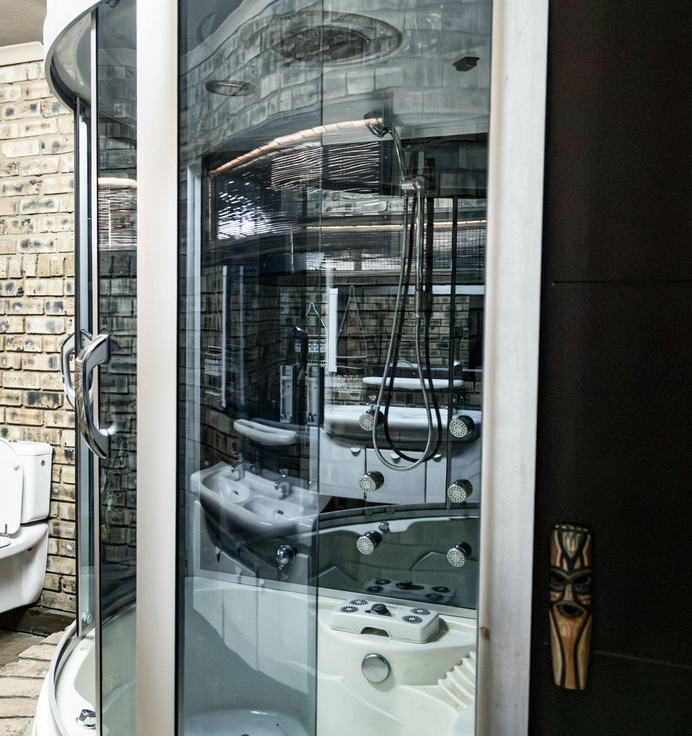 Luxury spa shower unit in modern en-suite bathroom