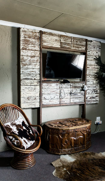 Rustic lounge area with television and comfortable seating