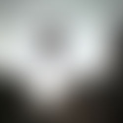 Person mid-air leaping between two rocky cliffs at sunset, symbolizing the bold leap of faith required to embrace one's authentic self and overcome fear or self-doubt.