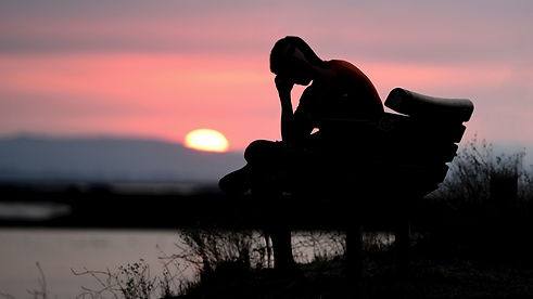 man_is_sitting_alone_sad_in_silhouette_background_4k_hd_sad-1600x900.jpg