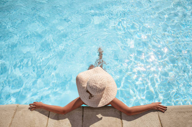 Eye-level view of a serene poolside lounge area with elegant seating