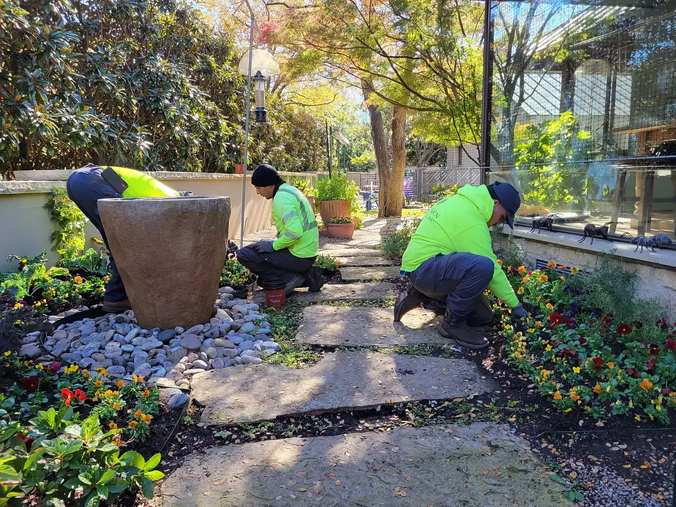Backyard remodel showing turf, hardscape, and lighting installed by Platinum Outdoors