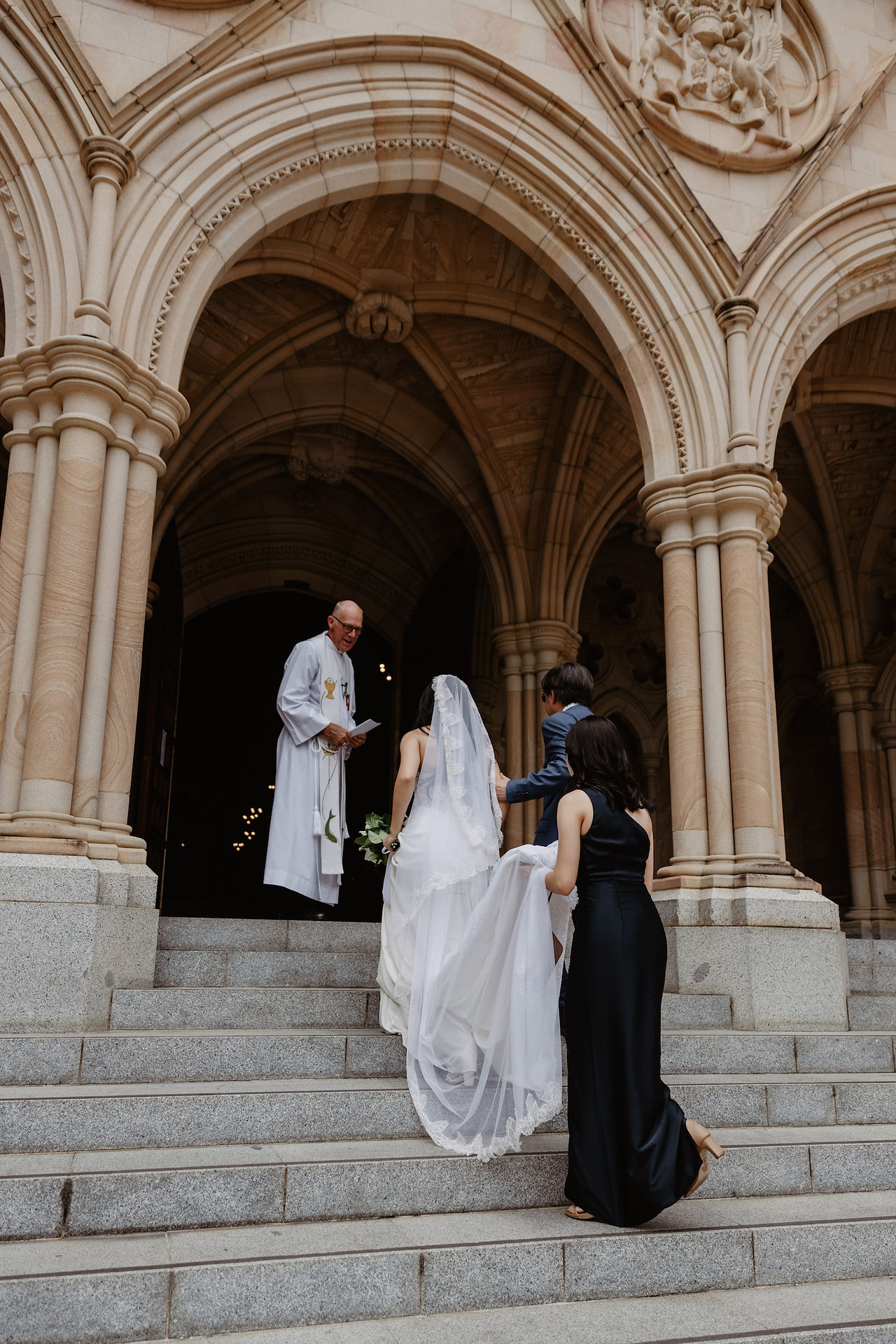 bride entering chapel at st paul's cathedral Brisbane with priest