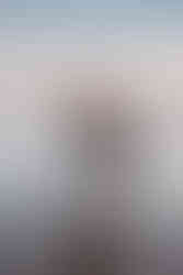 guy carrying acoustic guitar with partner on the spit beach gold coast at sunset