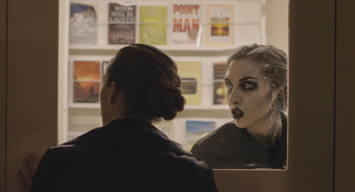 duplicates staring at each other through door special effects make up window