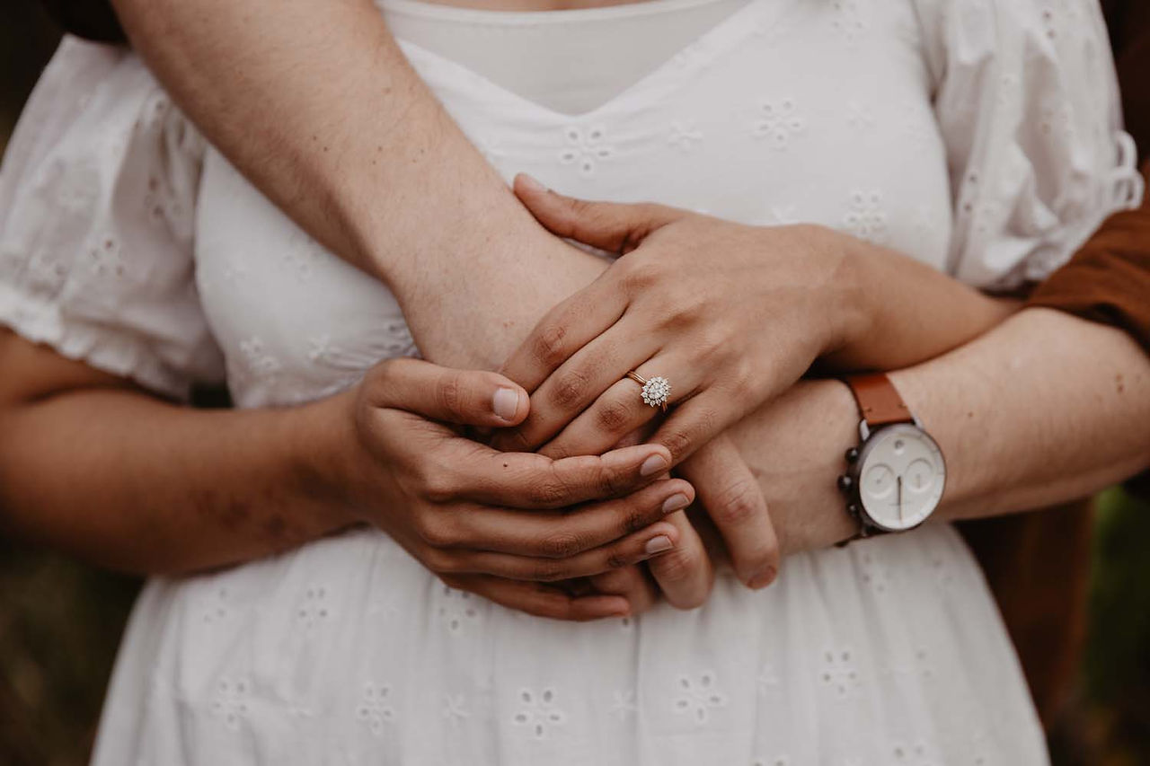 engagement ring shot with indian girl and caucasian guy