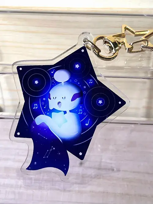 Thumbnail: Star-shaped Snorlax acrylic keychain with a night sky design
