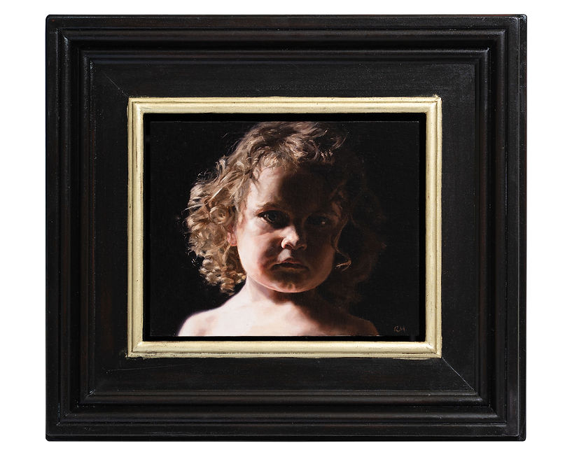 framed oil painting of a child's face in bright light with a dark background. Curly hair. Gold leaf on the frame.