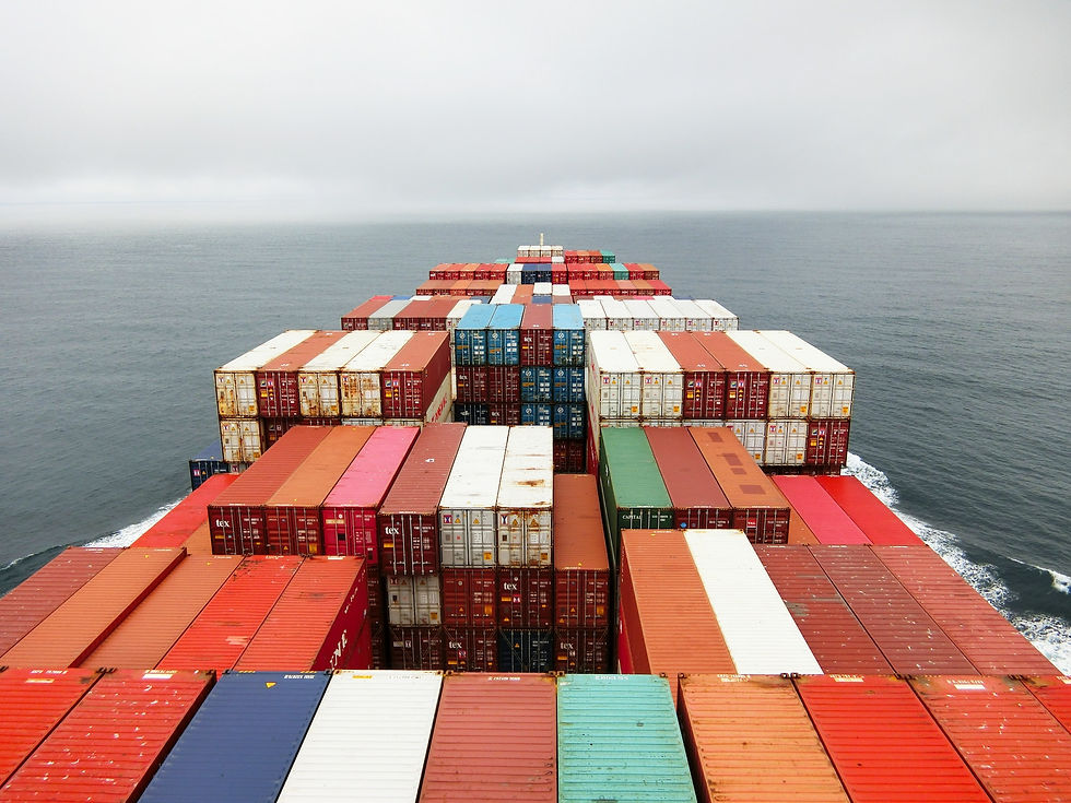 A ship with lots of goods that are crowding the deck