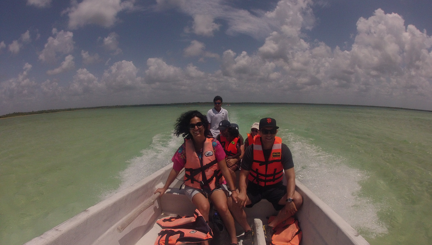 Tourists and the captain enjoying a boat ride in the lagoon
