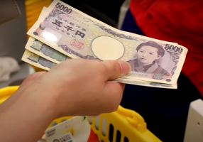 Japan's finance minister highlights urgency as yen weakens