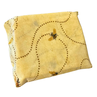 A block of cheese wrapped up in a beeswax food wrap