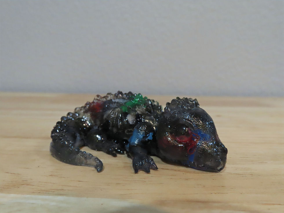 Handmade resin dragon with unique recycled colors, eco-friendly and one-of-a-kind decorative piece.