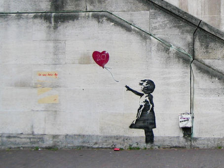 Banksy street art exploring anonymity and identity in contemporary art