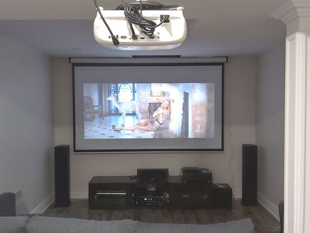Custom home theater installation with projector and surround sound in Newmarket