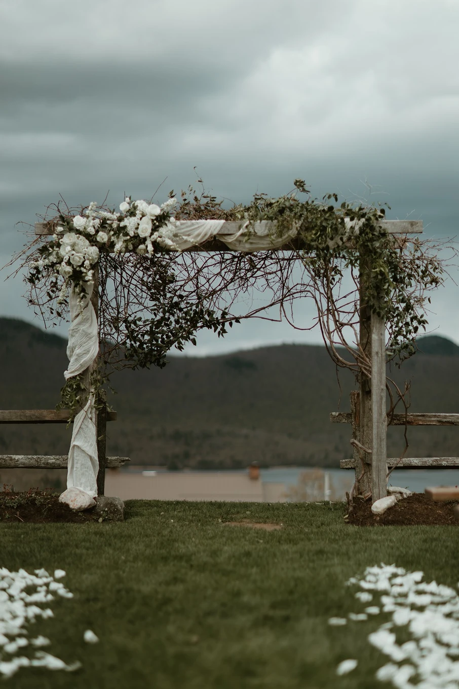 rustic and modern ceremony arch with draping and vines