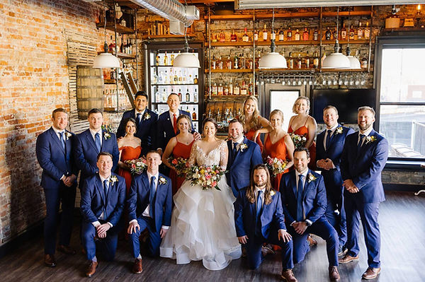 wedding party portrait at the bar of an industrial wedding venue in mn