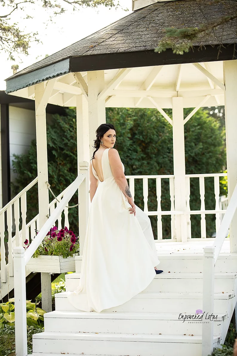 bride walking up steps to wedding venue gazebo