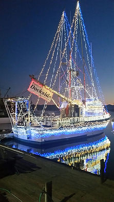 Image of vessel Bonnie Marietta with Christmas lights at dusk