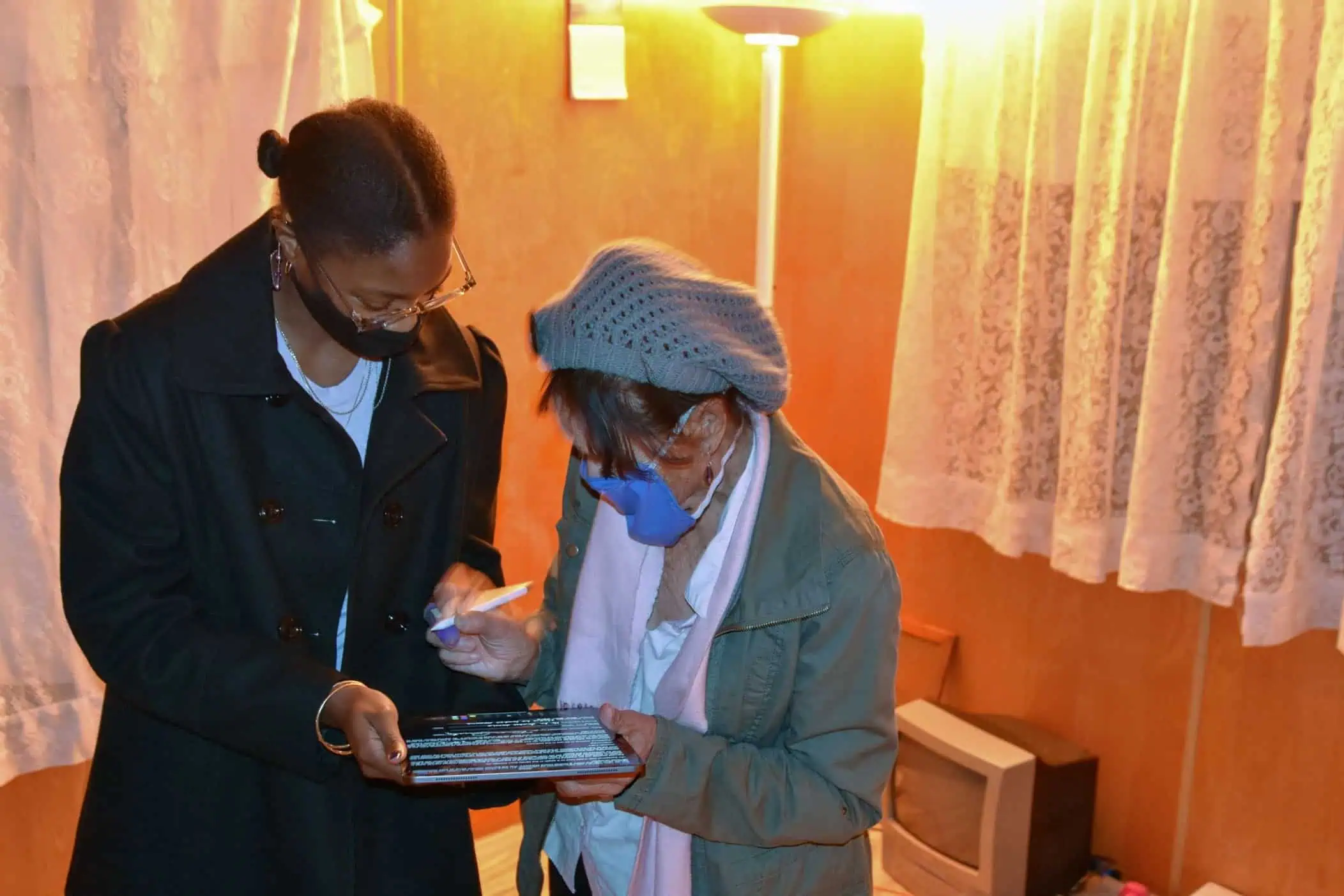 2 woman wearing face mask