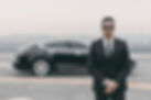 serious-bodyguard-standing-with-sunglasses-and-security-earpiece-on-helipad-e1631420854839