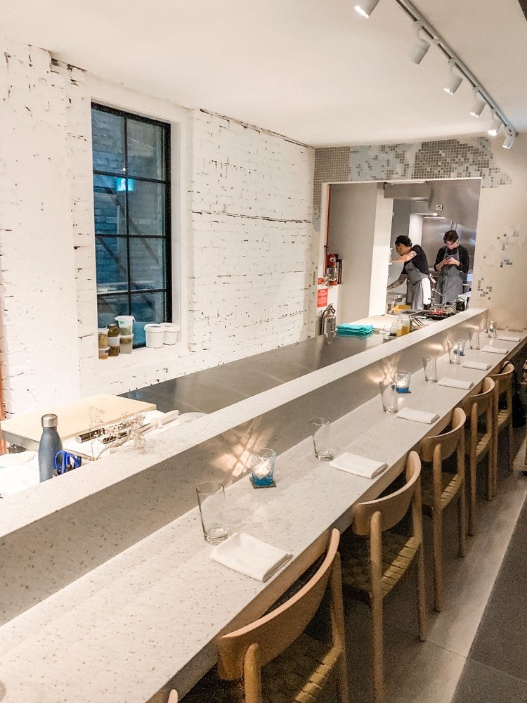 Modern bar counter with wooden chairs in a custom project interior