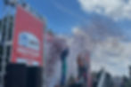 Pato O'Ward stands on the top of the podium after the conclusion of the Ontario Honda Dealers Indy (NATASHA PINTO/INTERMISSION SPORTS)