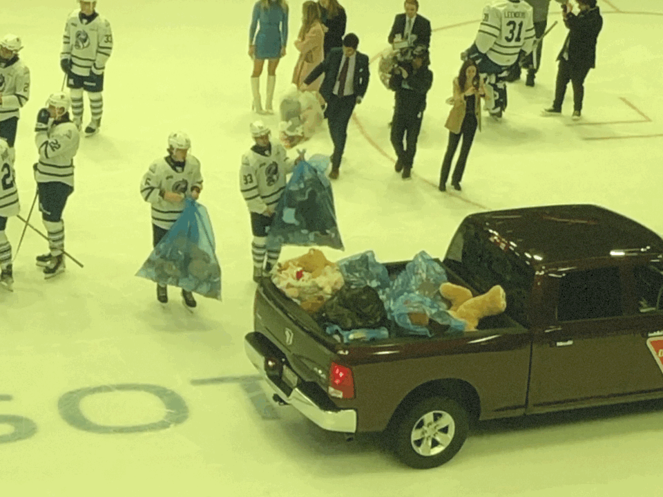 Mississauga Steelheads players help load a truck full of teddy bears on their Teddy Bear Toss night at Paramount Fine Foods Centre.