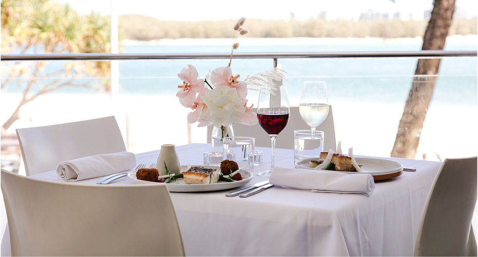 Beachside Wedding Venue with table setting overlooking the beautiful blue ocean