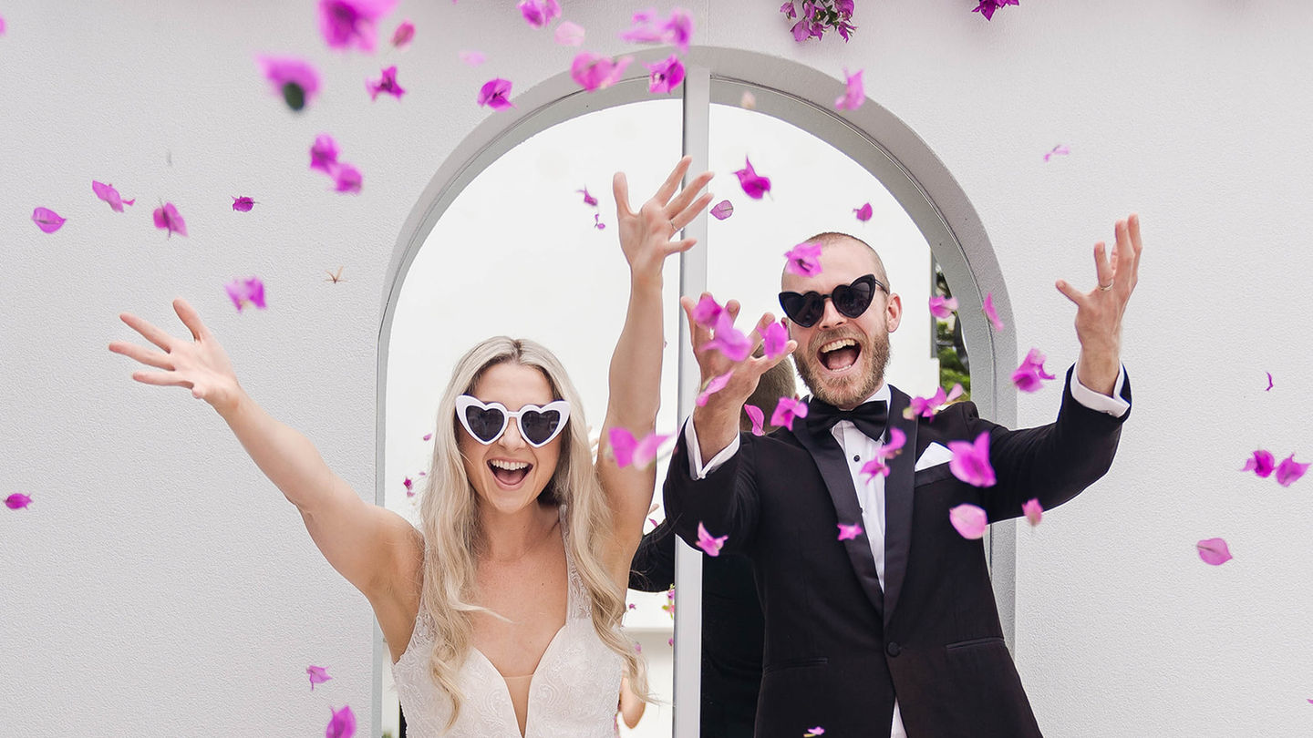 Just married couple throwing the confetti for their wedding photos on the Sunshine Coast in Queensland