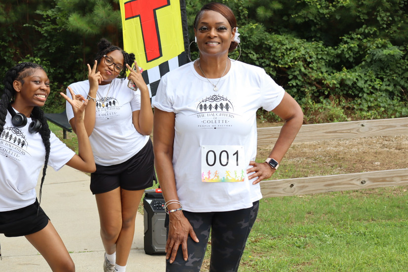 Founder and volunteer posing for picture at the walk event.
