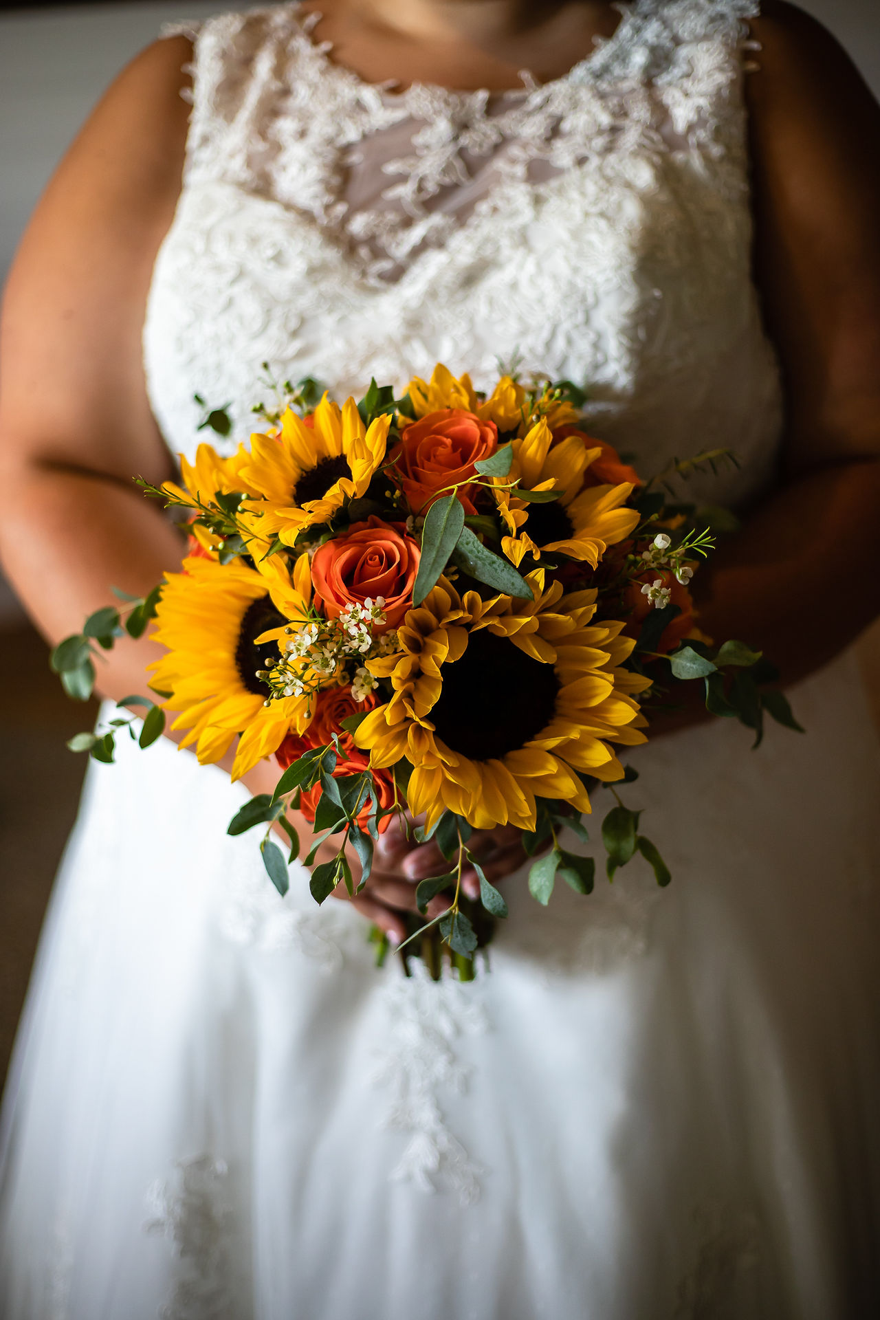 Lace dress, sunflower bouquet.