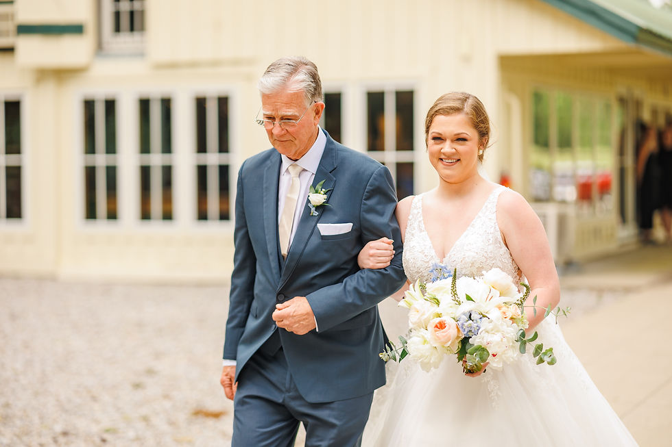 The bride's father walks her down the aisle.