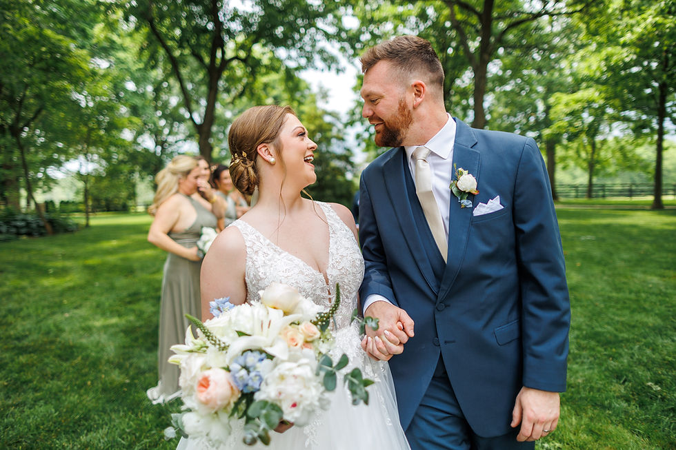 Wedding couple looks happily at each other.