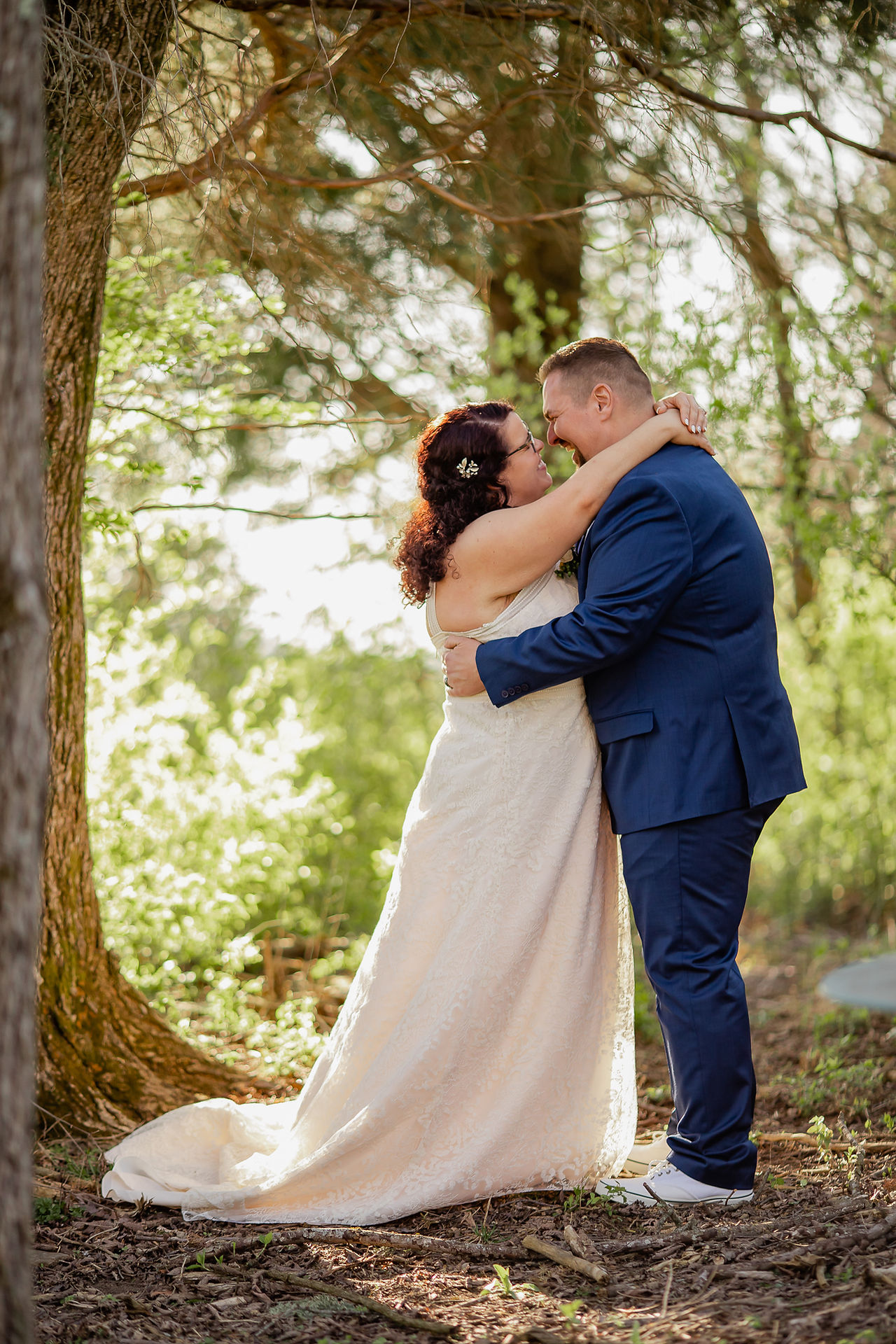 Bride and groom prepare for a kiss during portraits.