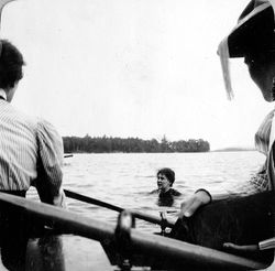 41a, woman swimming with boats