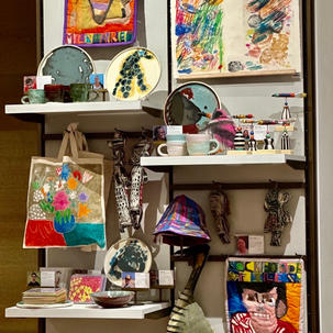 A set up of CCW art at the shop at Philadelphia MOA