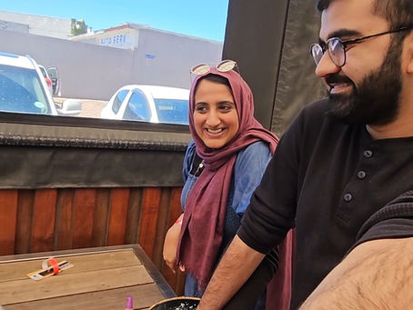 A couple enjoying date night at a hand casting experience